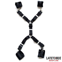 Ties in black woven fabric with adjustable straps, metal clips and padded cuff loops