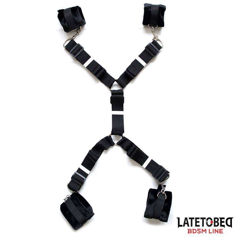 Ties in black woven fabric with adjustable straps, metal clips and padded cuff loops