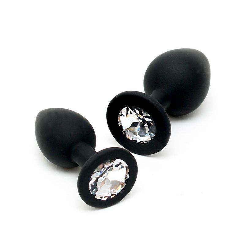 Anal plug set in matte black silicone with faceted clear crystal-style jewels and rounded flared bases