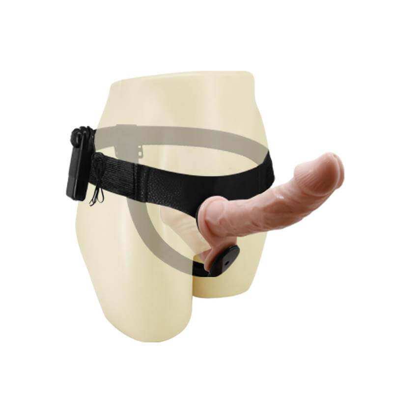 Dobles cream-colored mannequin lower torso wearing a flesh-toned prosthetic with a black adjustable waist strap