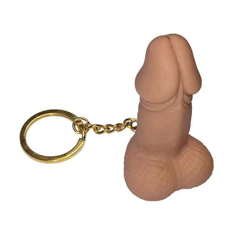 Keychain with a tan, sculpted novelty phallic charm attached to a gold-tone chain and round metal ring