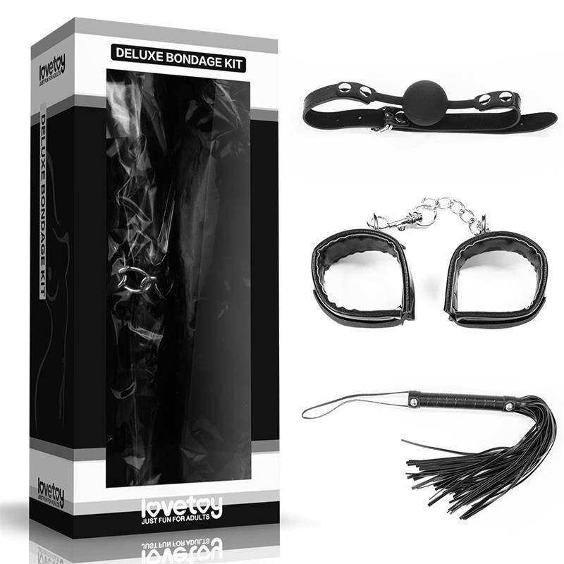 Kits BDSM with black faux leather blindfold, wrist cuffs, ankle restraints and fringed flogger in a deluxe kit box