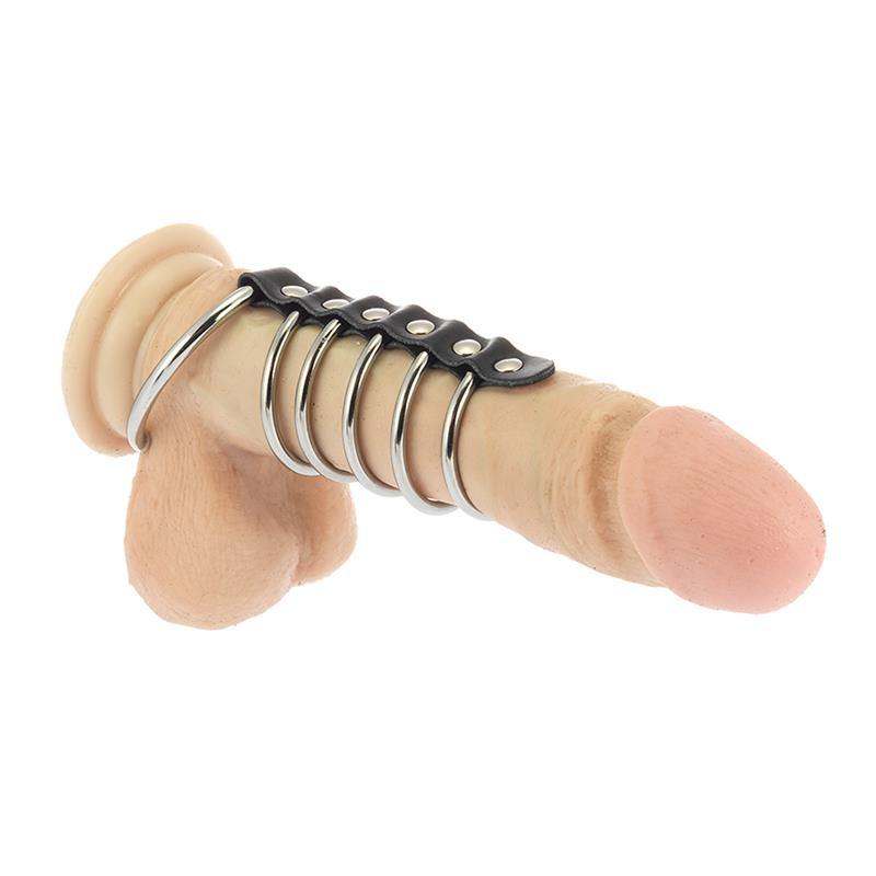 Metal Cock Ring with silver metal loops attached to a black adjustable strap, shown on a skin-toned model