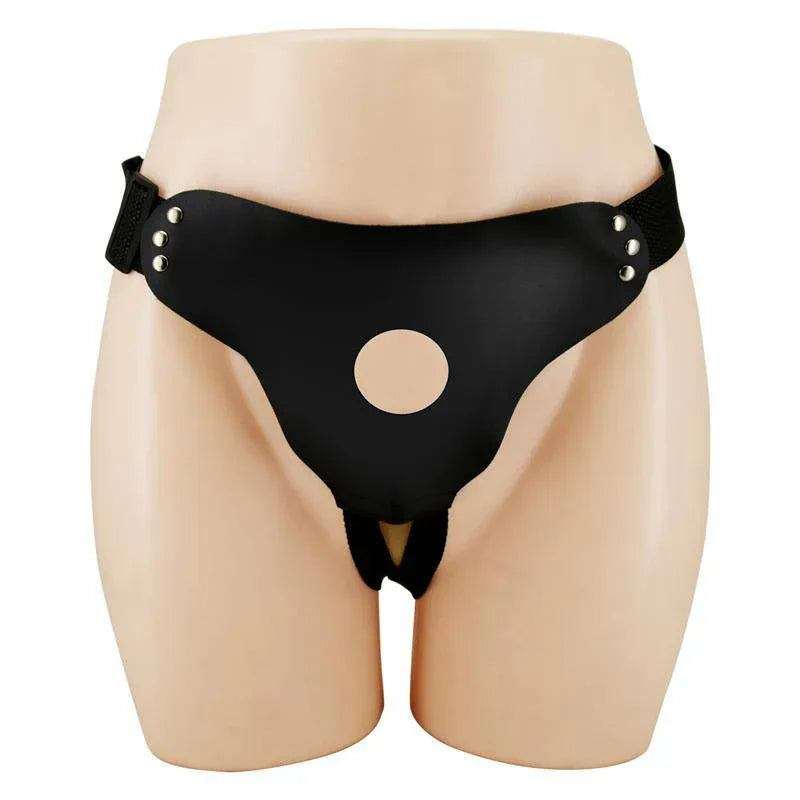 No Dildo black leather-look harness with side straps, silver studs and a round opening on a mannequin