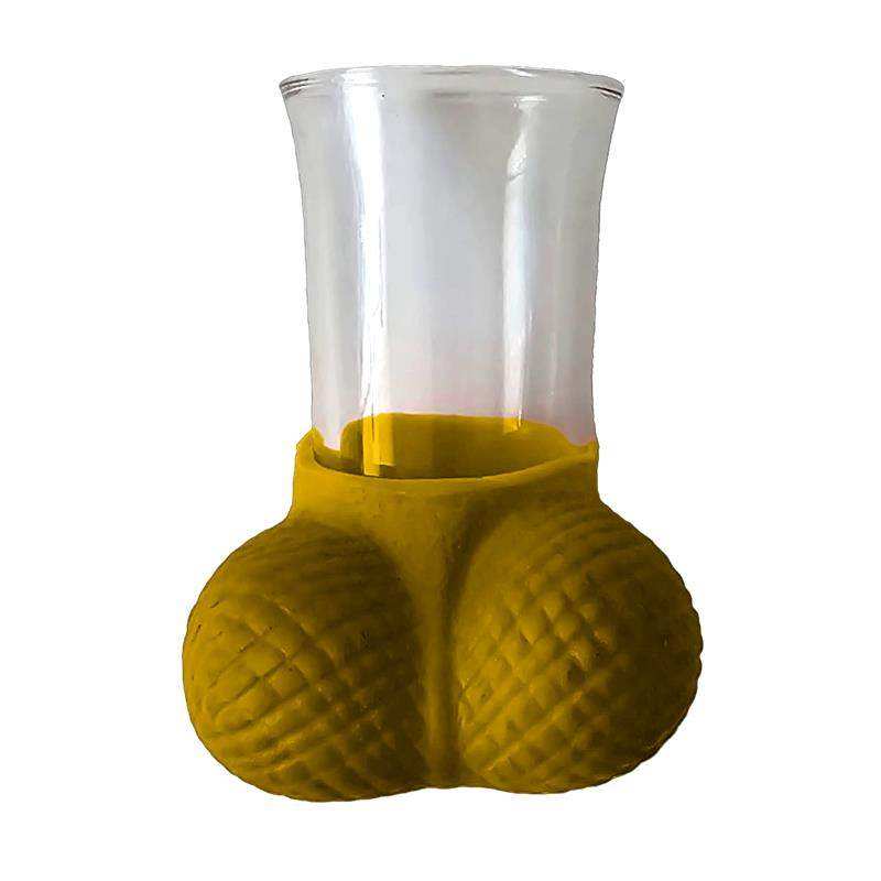 Shots Glasses with a clear cylindrical cup set in a mustard-yellow textured base shaped like two rounded forms