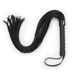 Set of whips, paddles, and floggers for intimate play and exploration