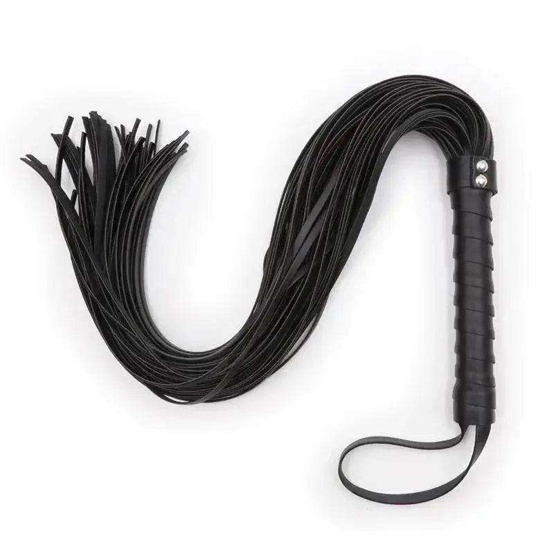 collection of whips paddles and floggers for BDSM impact play