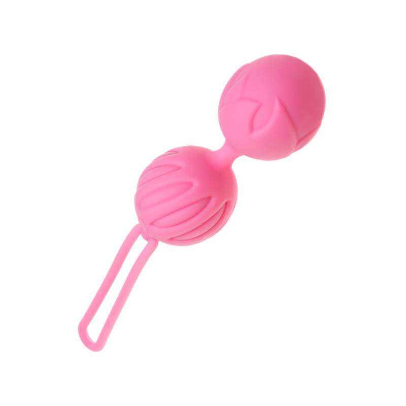 Woman Health pink pelvic floor exercise ball with a loop handle and molded ridged texture