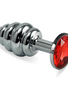 Spiral Butt Plug Rosebud with red jewel, metal anal plug with rounded tip, slim neck, spiral shaft and base