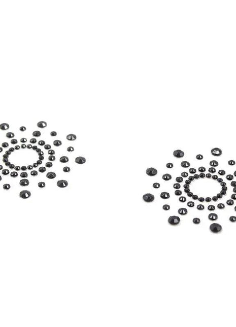 Black snowflake nipple covers designed for comfort and style, reusable and waterproof.