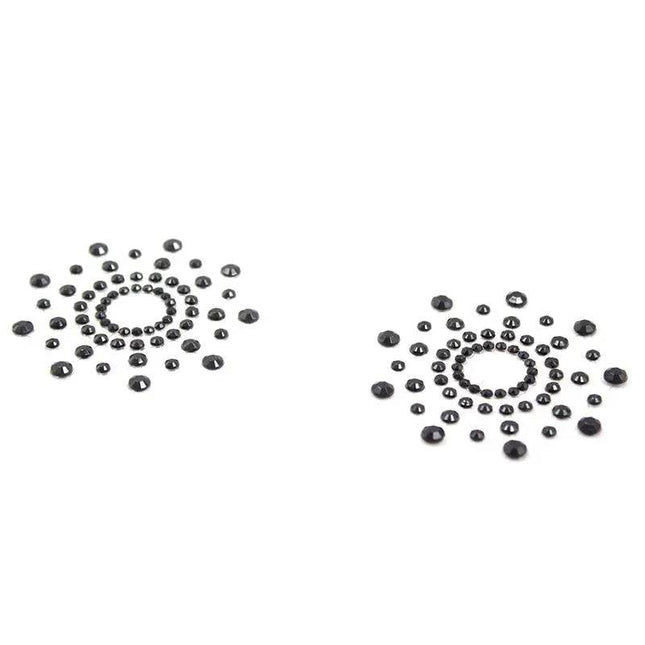 Black snowflake nipple covers designed for comfort and style, reusable and waterproof.