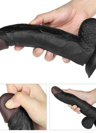 Adjustable Strap on dildo with a black textured shaft, rounded brown tip, raised details and flared base