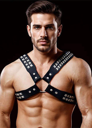 Adonis Chest Bondage Harness in black vegan leather with an X-shaped design, silver studs, buckles and central ring