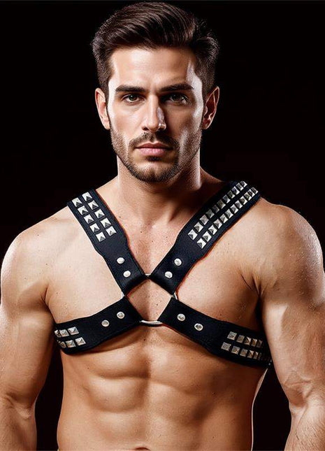 Adonis Chest Bondage Harness in black vegan leather with an X-shaped design, silver studs, buckles and central ring