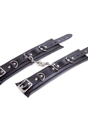 Ankle Cuffs Black with smooth black leather straps, silver buckles, adjustable holes and connecting chain