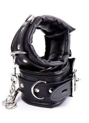 Ankle Cuffs Black featuring padded leather-like bands, silver-tone studs, buckles, and attached chain hardware