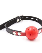 Ball Gag Breathable Black/Red with a red perforated ball and black and red adjustable strap with metal studs