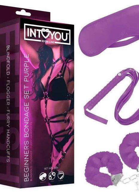Beginners Bondage Set with purple blindfold, satin restraints and fluffy handcuffs with metal clips in retail packaging