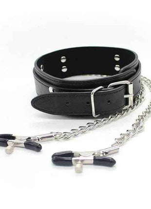 A black leather collar with an adjustable buckle connected to two silver metal chains attached to nipple clamps.