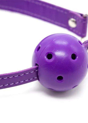 Bondage Set 10 Pieces Purple featuring a glossy purple ball gag with perforated openings and adjustable stitched straps
