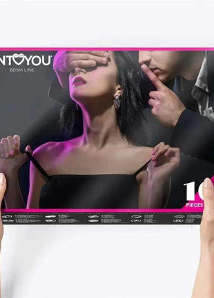 Bondage Set 10 Pieces Purple in a black-and-pink INTTYOu box, showing a blindfolded woman and ten-piece label