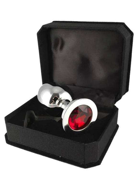 Butt plug metal shown with a polished silver finish, tapered shape and prominent red jewel set in its flared base