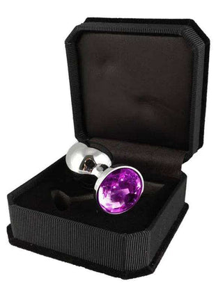 Butt Plug with cristal featuring a polished silver-toned base and large faceted purple crystal in a black case