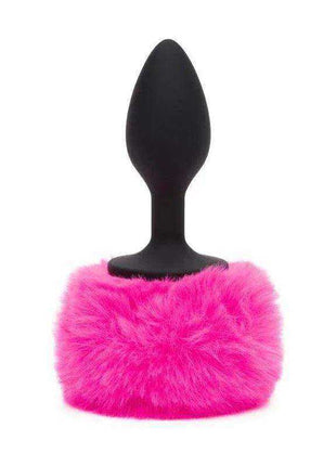 Butt Plug with Pink Fur Tail featuring a smooth black tapered silicone plug and a fluffy bright pink fur tail