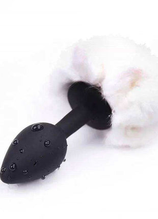 White small butt plug with playful pompon for beginners