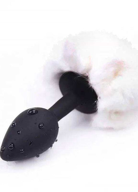 White small butt plug with playful pompon for beginners