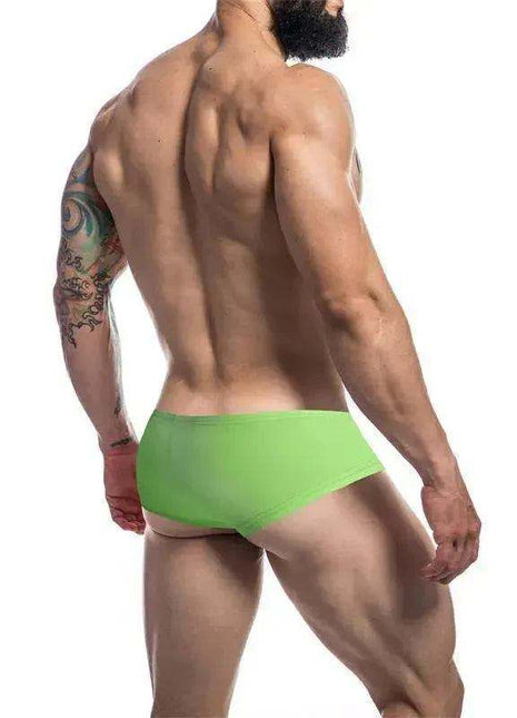 C4M Booty Shorts in bright neon green stretch fabric, featuring a fitted low-rise cut and smooth solid-color finish