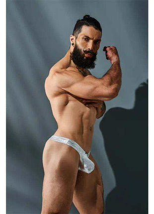 C4MPE02 Pouch Enhancing Thong Pearl in white with a subtle pearlescent pattern and supportive pouch design