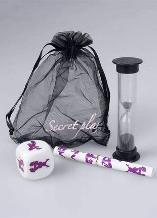 Chronomasutra Lesbian Couples Kit with a black mesh drawstring pouch, printed white die and purple-patterned tube