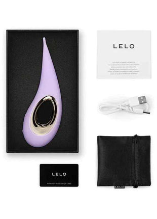 Clitoris Stimulator in lilac silicone with a tapered flexible tip and oval black-and-gold control panel, shown with accessories