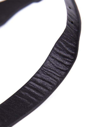 Adjustable black pet collar with built-in bell for safety and style