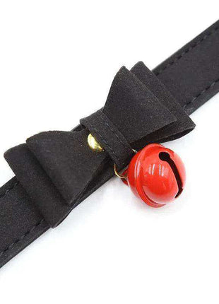 Collar with Bow and Rattle featuring a black strap, layered black bow, and bright red bell charm.