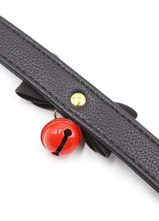 Collar with Bow and Rattle featuring a textured black strap, black bow and bright red bell with a gold stud