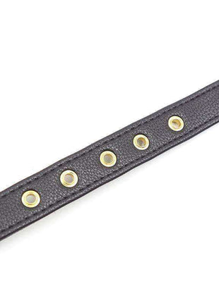 Collar with Bow and Rattle featuring a dark charcoal textured strap with five round gold-tone eyelets