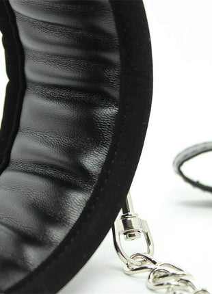 Collar with Metal Leash in black padded material, showing a ridged interior and attached silver metal chain