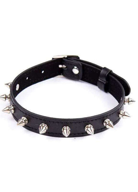 Collar with Spikes in black synthetic leather with silver cone-shaped studs, an adjustable buckle and stitched edges