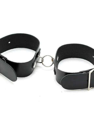 Cuffs Adjustable in black leather with silver-tone buckles and a connecting metal ring