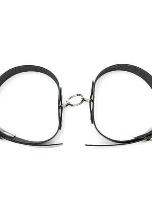 Cuffs Adjustable, black leather-look straps with silver-tone buckles and a connecting metal ring