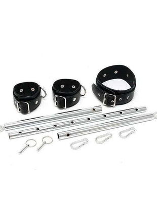 Cuffs with spreadbar featuring black leather straps, silver buckles, perforated metal bars and fastening clips