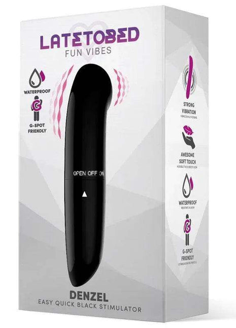 Denzel Stimulator, a slim black vibrator with a tapered rounded tip, shown in white packaging with purple accents