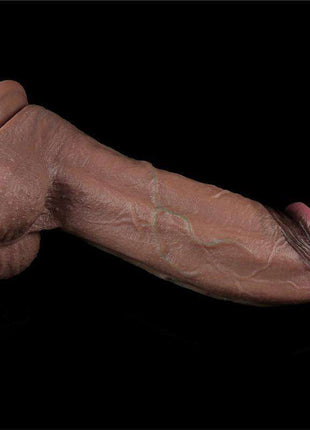 Dildo Dual Layered Silicone XXL 11, flesh-toned silicone with realistic veining, a rounded tip and textured base.