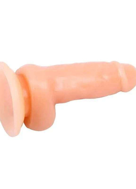 Dildo Realistic T-Skin in peach-toned skin-like material, with a flared base, textured shaft and rounded tip