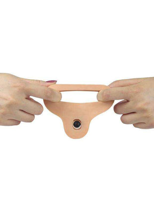 Dildo The Ultra Soft Double in flesh-toned, soft flexible material, with a stretchable strap and vibrating bullet at the base.