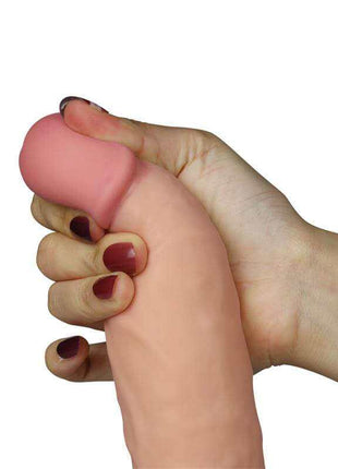 Dildo The Ultra Soft Dude, a smooth flesh-pink silicone vibrator with a rounded tip and gently curved shaft