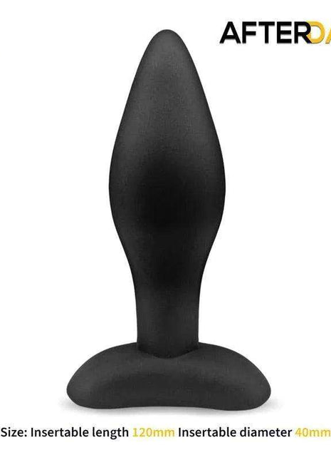 Dolmen Butt Plug in black matte silicone, with a tapered rounded tip, curved shaft and wide flared base