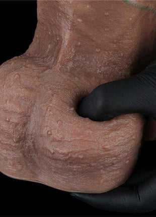Dual Layered Dildo in mottled pale pink silicone with a deeply textured, wrinkled shaft and rounded tip
